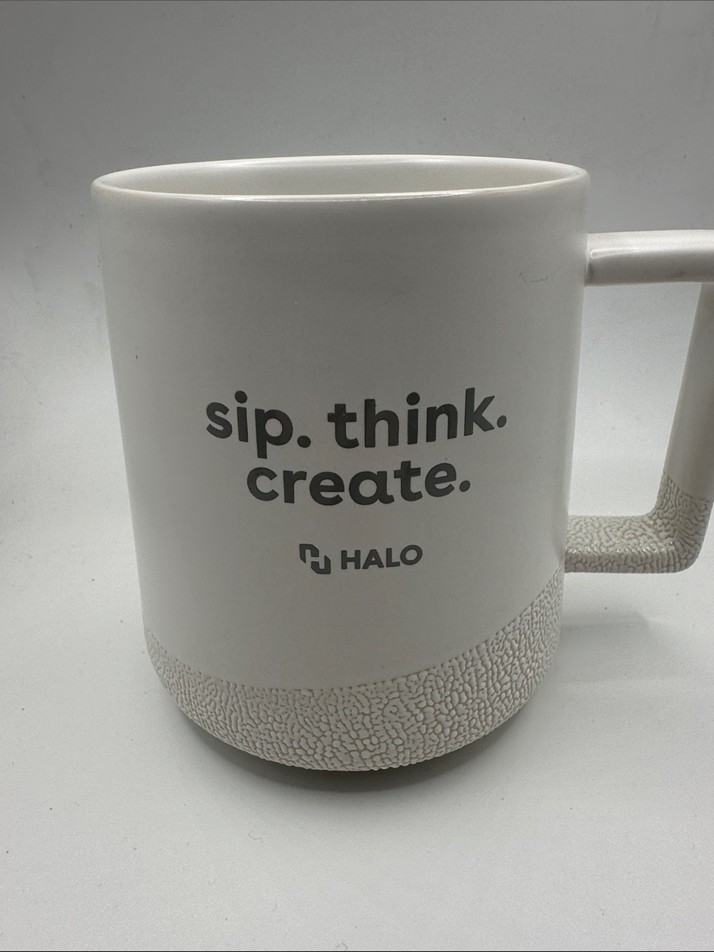 Halo White Ceramic Mug with Gray Text and Textured Base 4.5" High 3.5" Wide